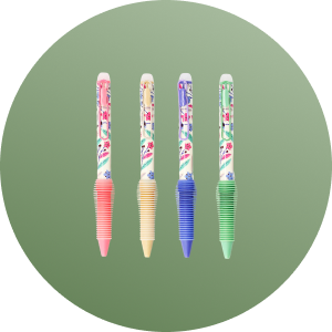 Four colorful pens with decorative patterns on a green background.