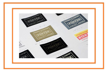 A range of colours of Porter Yoshida bag labels.