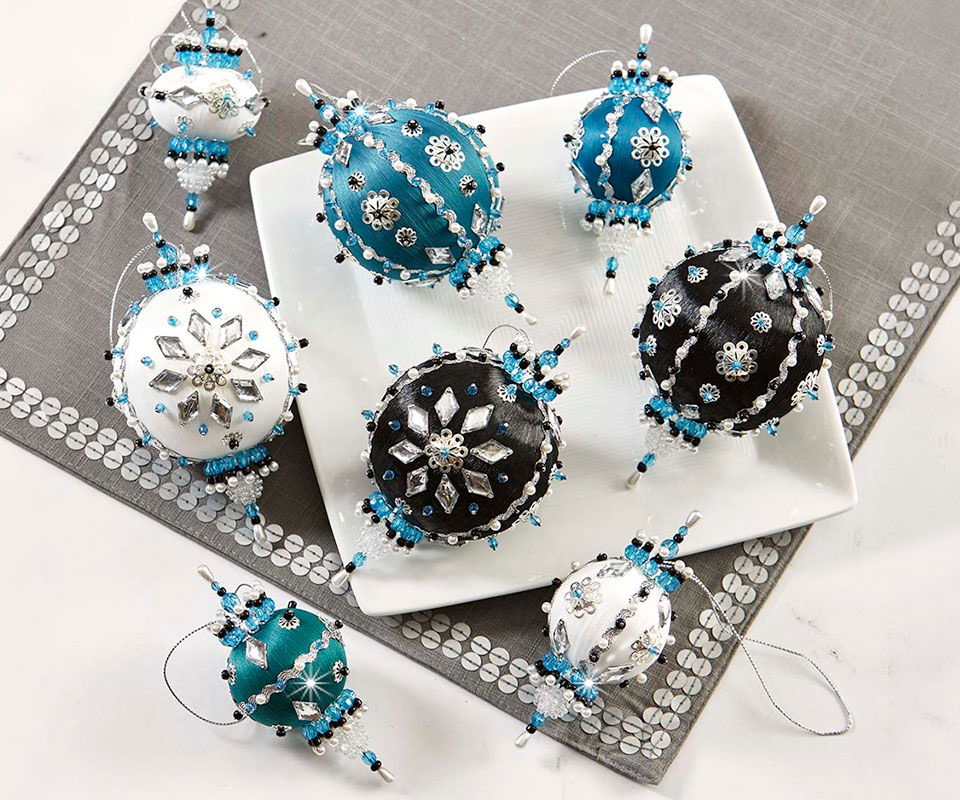 Colorful decorative ornaments arranged on a white plate.