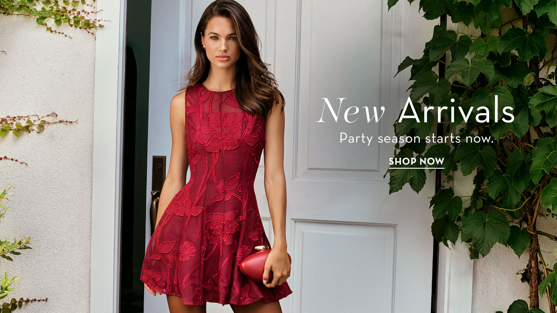 Model in a red dress showcasing new arrivals for a party collection.
