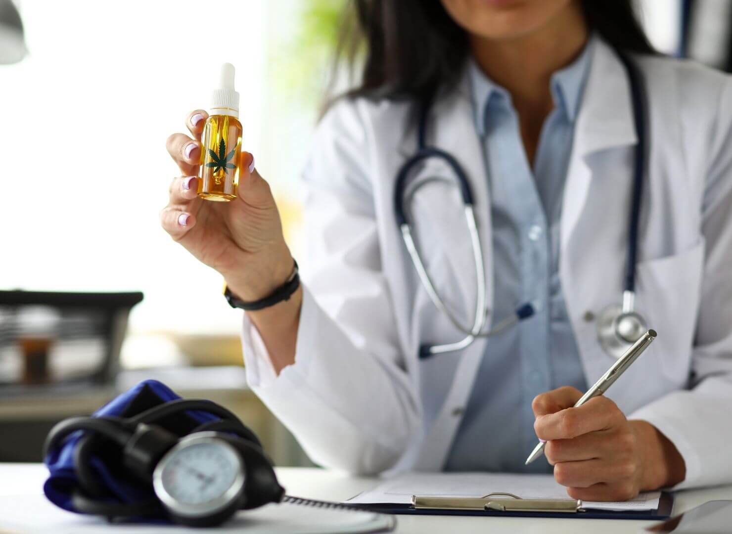 A doctor pointing a CBD oil-CBD for inflammation