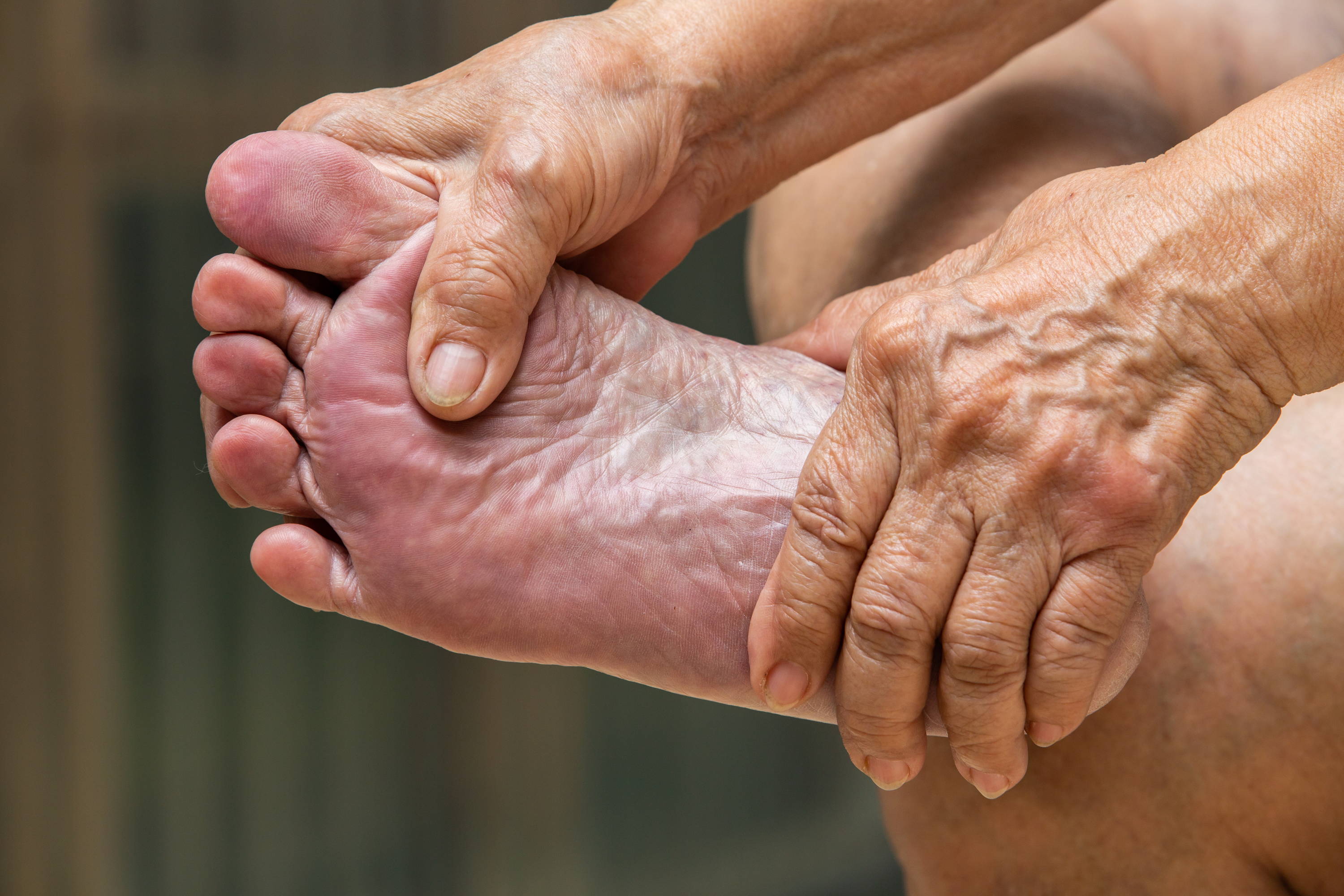 Foot examinations, Woman examining foot, SmartKnit Seamless Diabetic Socks