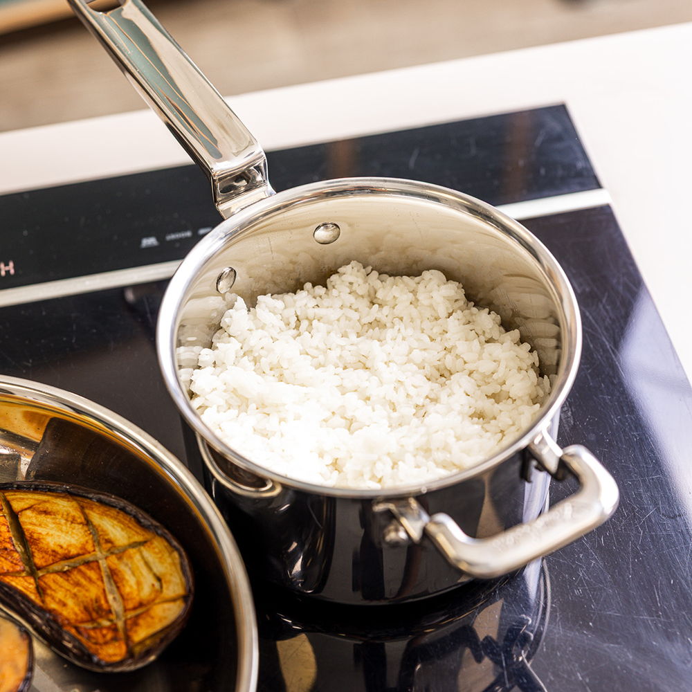 A 316 Series Pan with cooked rice on a stovetop.
