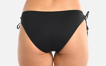 Back image, close-up of model wearing black side-tie swimsuit bottoms.