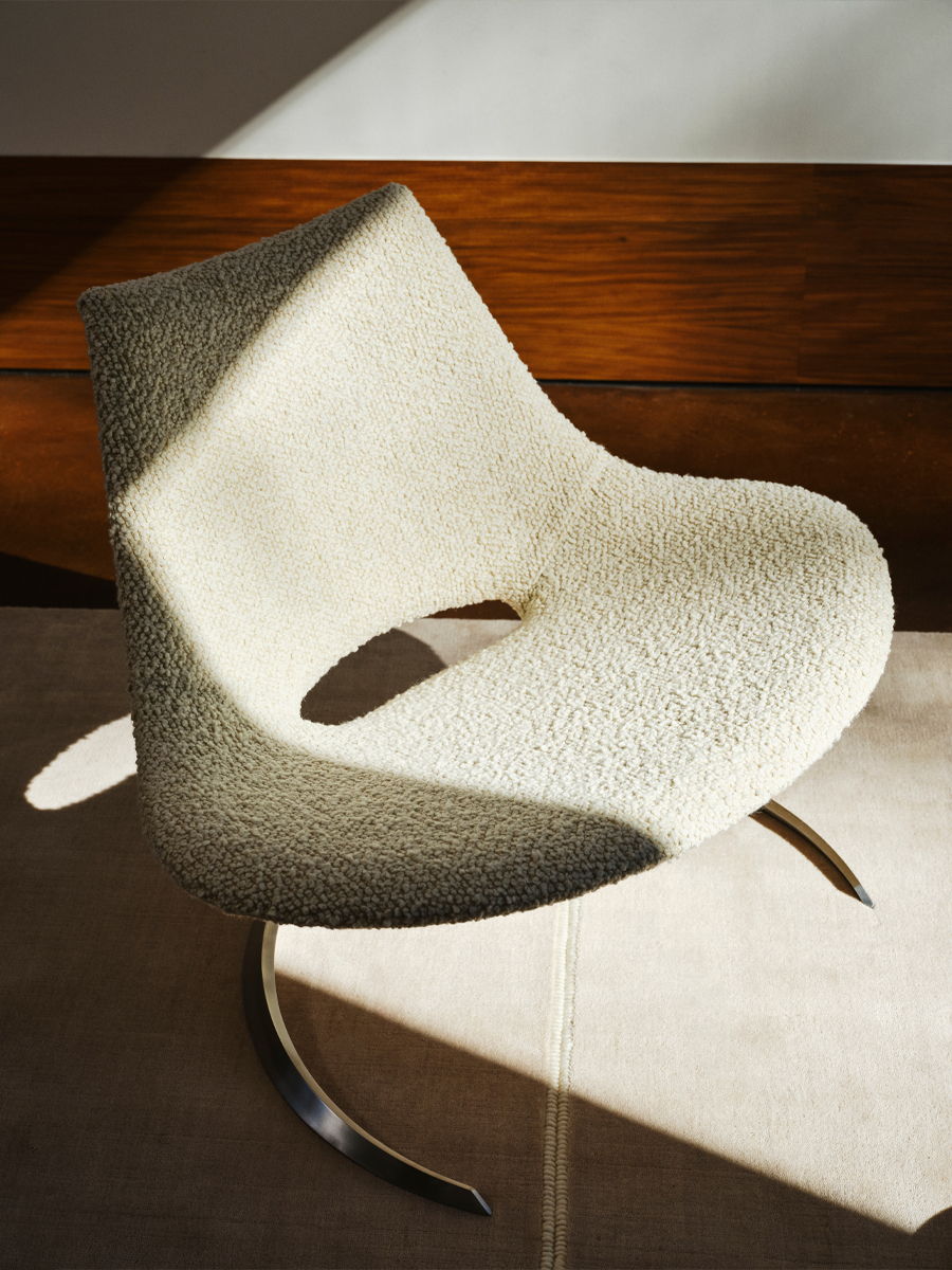 Stylish Carl hansen modern chair with a unique shape and soft upholstery.