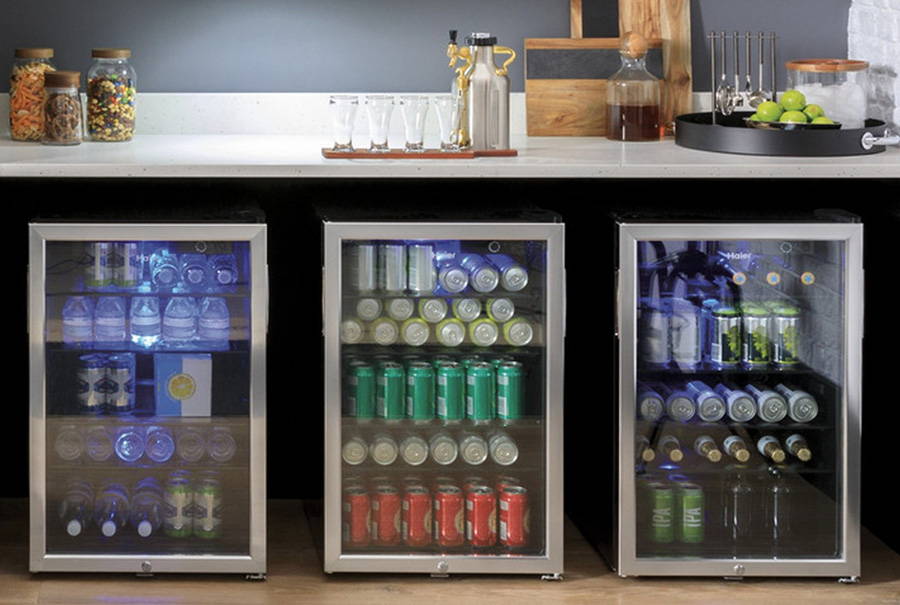 Three beverage centers installed in a rec room or man cave.