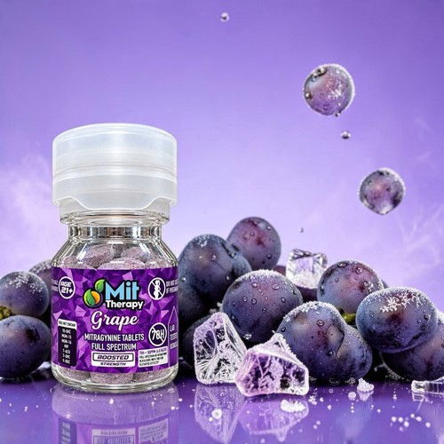 Bottle of grape flavor with grapes and ice cubes on a purple background.
