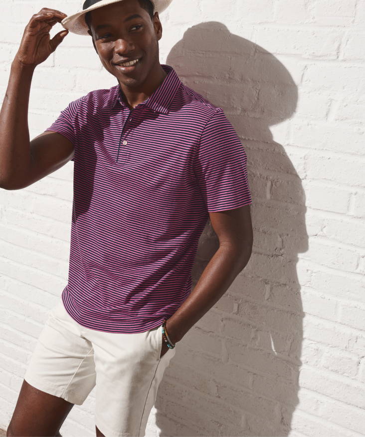Model is wearing UNTUCKit Segura stripe polo and St. Vincent - Chino shorts.