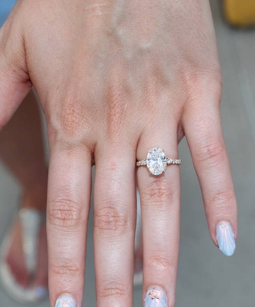 lucia oval engagement ring on hand
