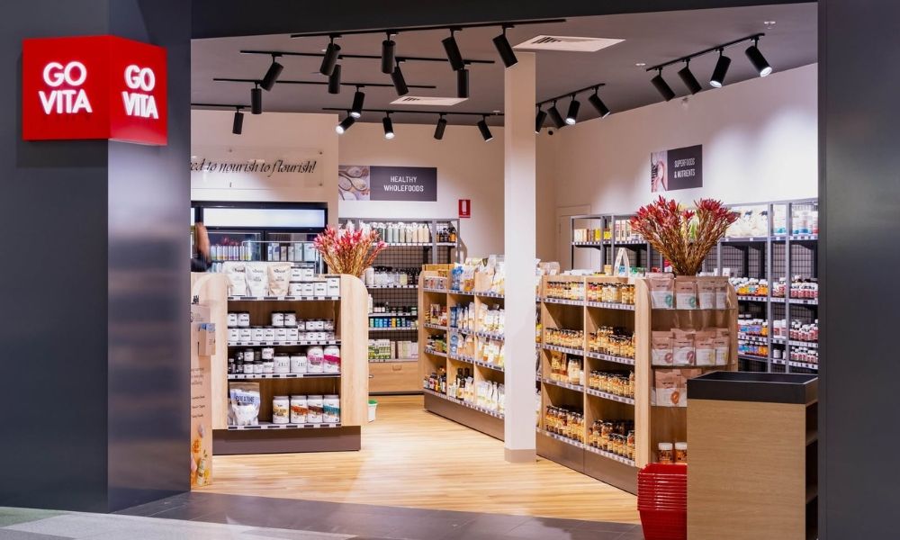 Store interior with shelves, products, and signage for 