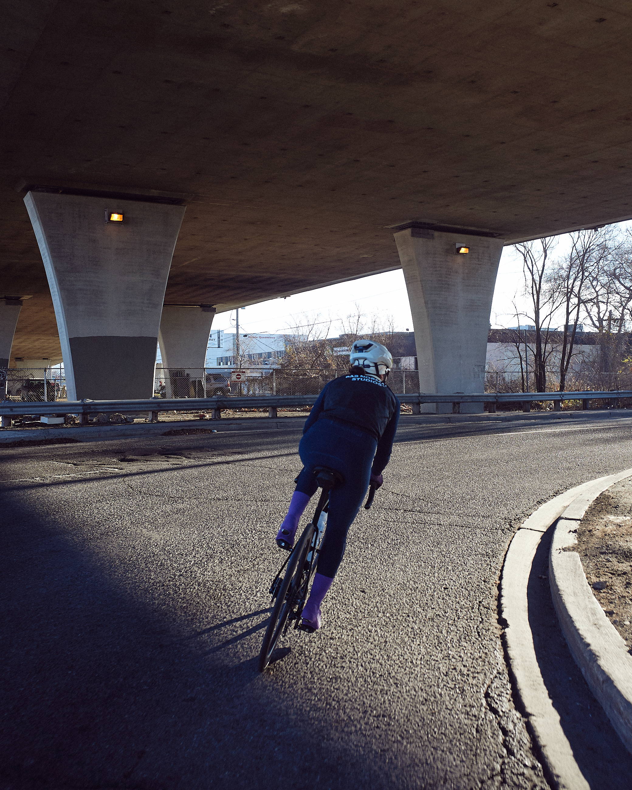 Female cyclist riding on the road