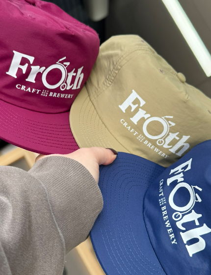 Hand holding 3 caps coloured Berry, olive, and blue white Froth Craft Brewery logo DTF printed on the front