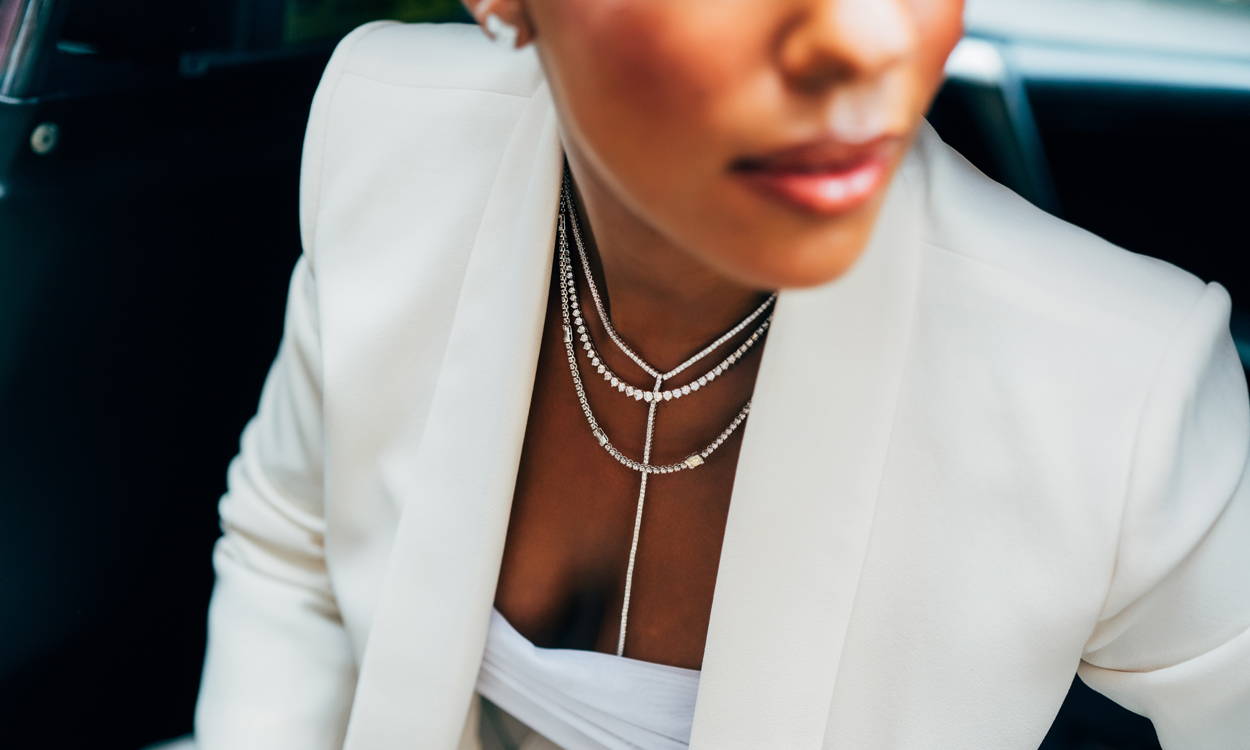 Model wearing Ring Concierge necklaces stepping out of a taxi