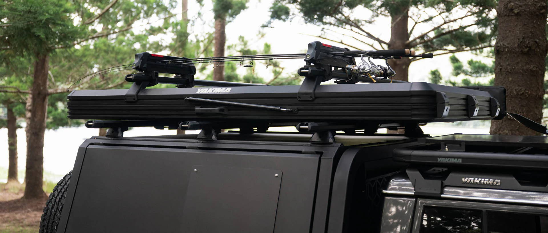A ute canopy with custom roof rack, rooftop tent and accessories installed