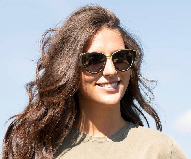 Woman wearing Kraywoods Willow, Bamboo Cat Eye Sunglasses Featuring 100% UV Protection, Polarized Lenses 
