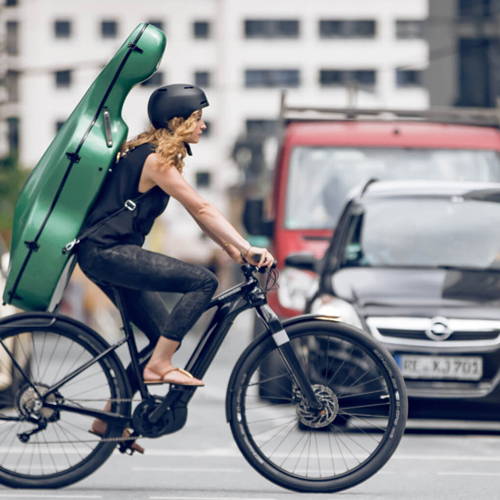 A commuter on her mountain-style commuter ebike hauling heavy cargo.