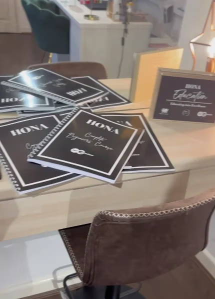 A table with menus and a brown chair.