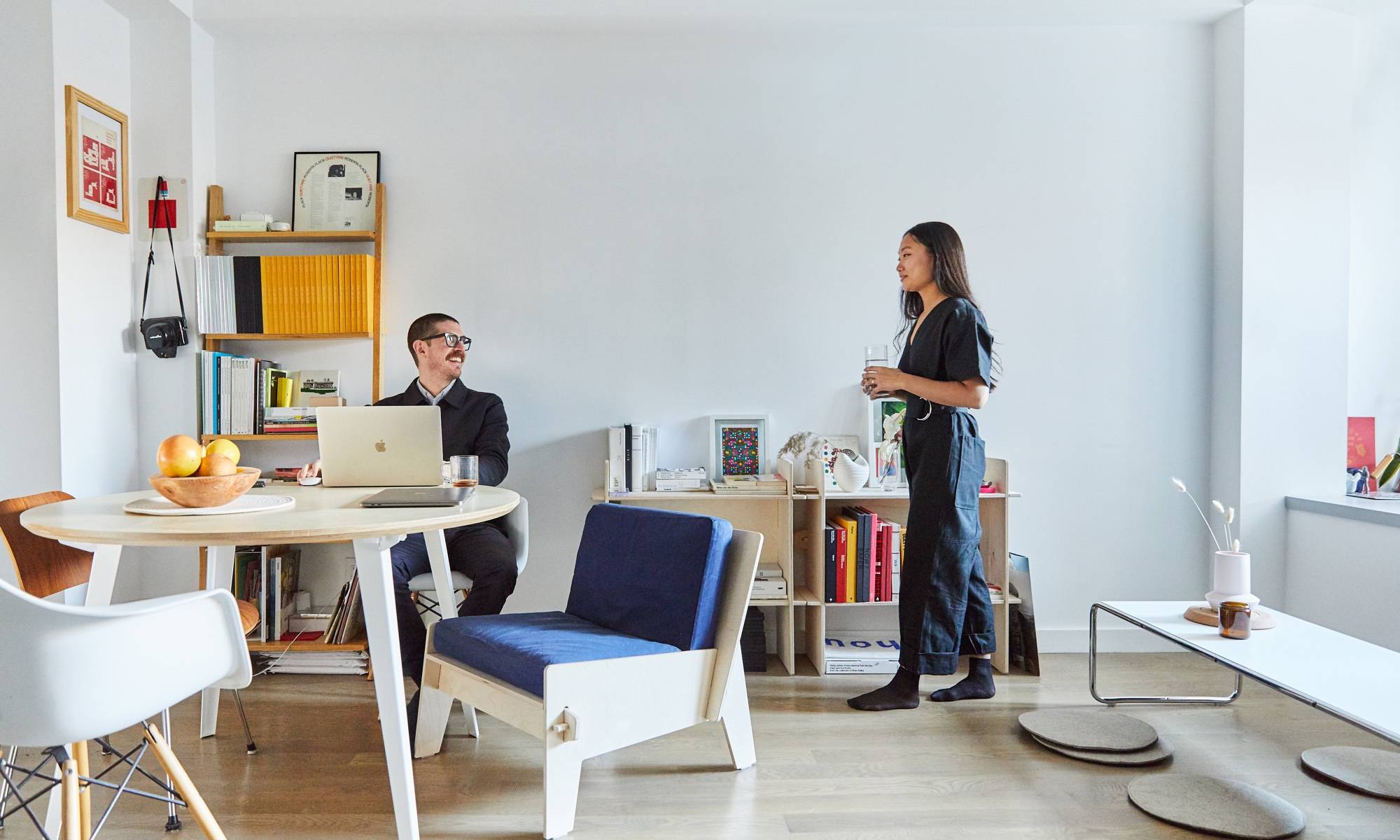 Couple Estee and JeIsse Reed  at round Floyd table and standing in living room