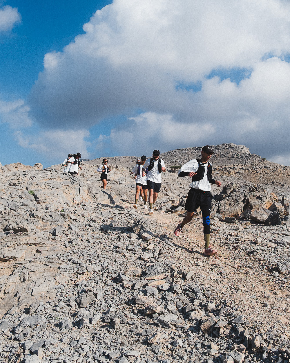 Trail runners running through Rainbow Valley