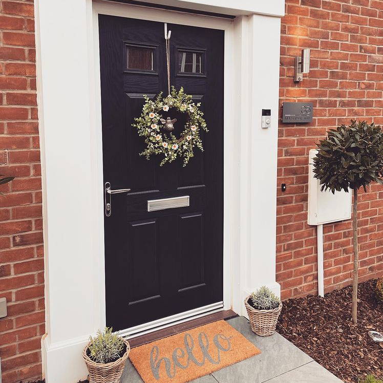 Flower wreath displayed on front door 