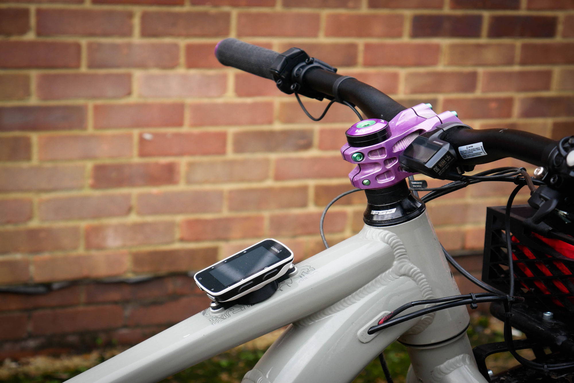 Close up of cockpit with Garmin mount and purple stem