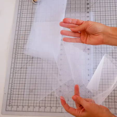 Showing 6 inch strips of white tulle fabric
