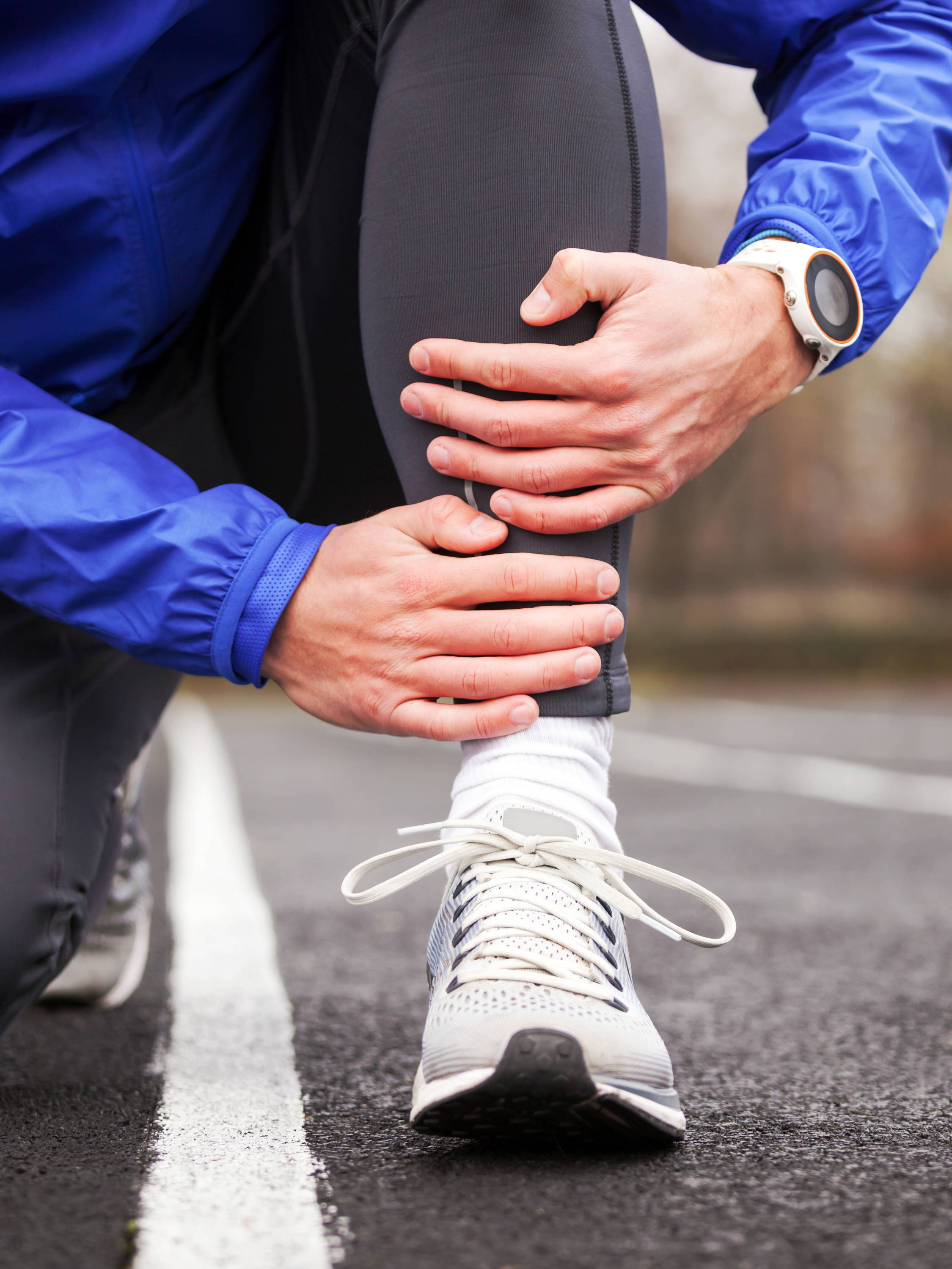 Man holding leg, man with leg pain