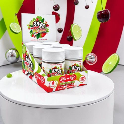 Display of a colorful product box with jars on a round table.