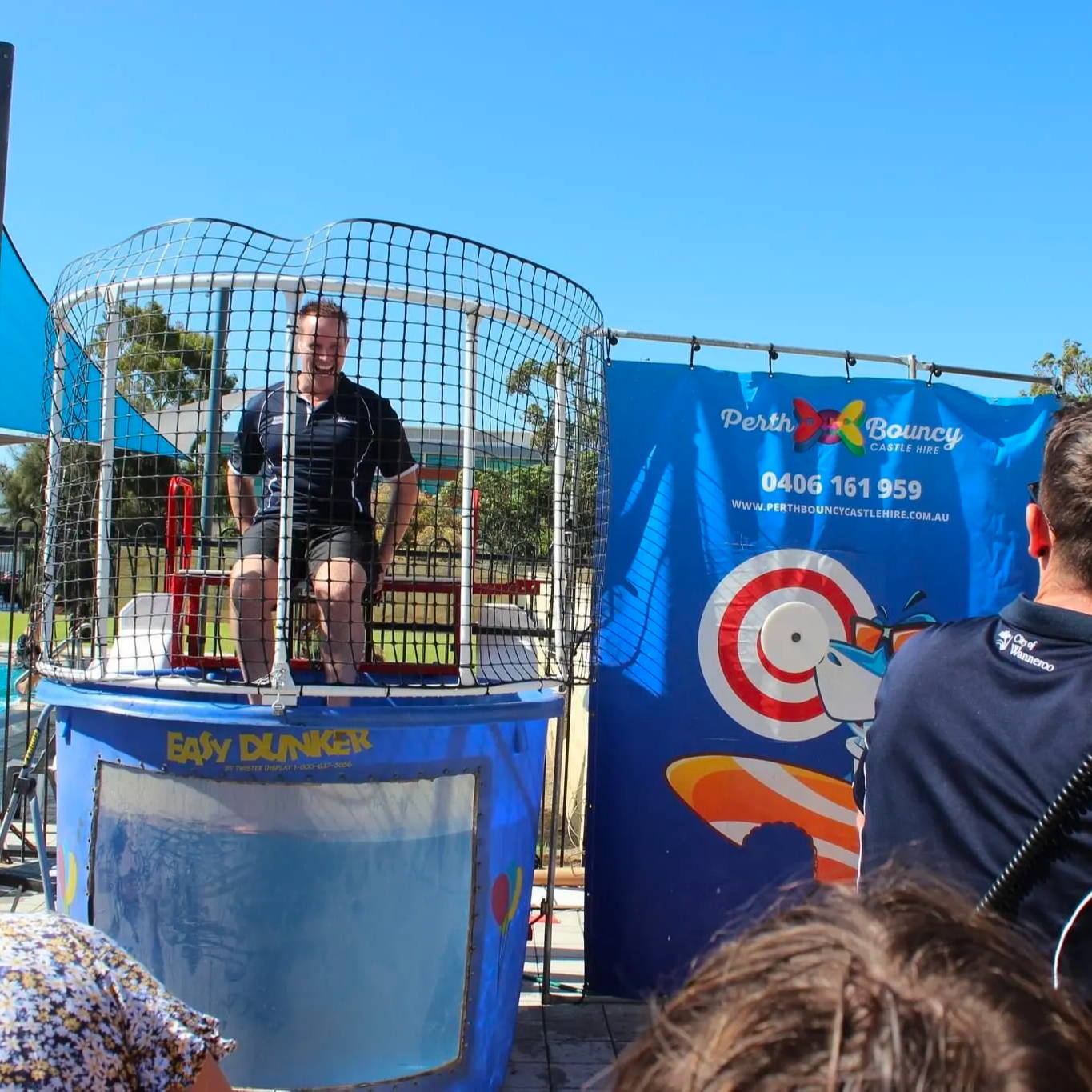 A dunk tank challenge with teachers and kids