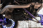 Shocker XL train horns and compressor mounted on purple suspension under Ismael's Chevrolet Silverado photo 2