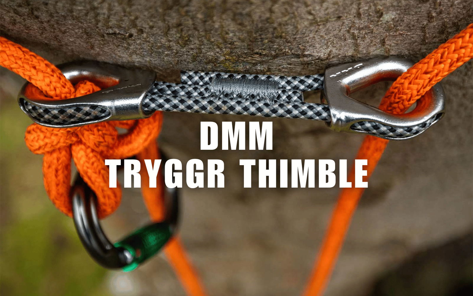 DMM Tryggr thimble attached to orange rope and black carabiner.