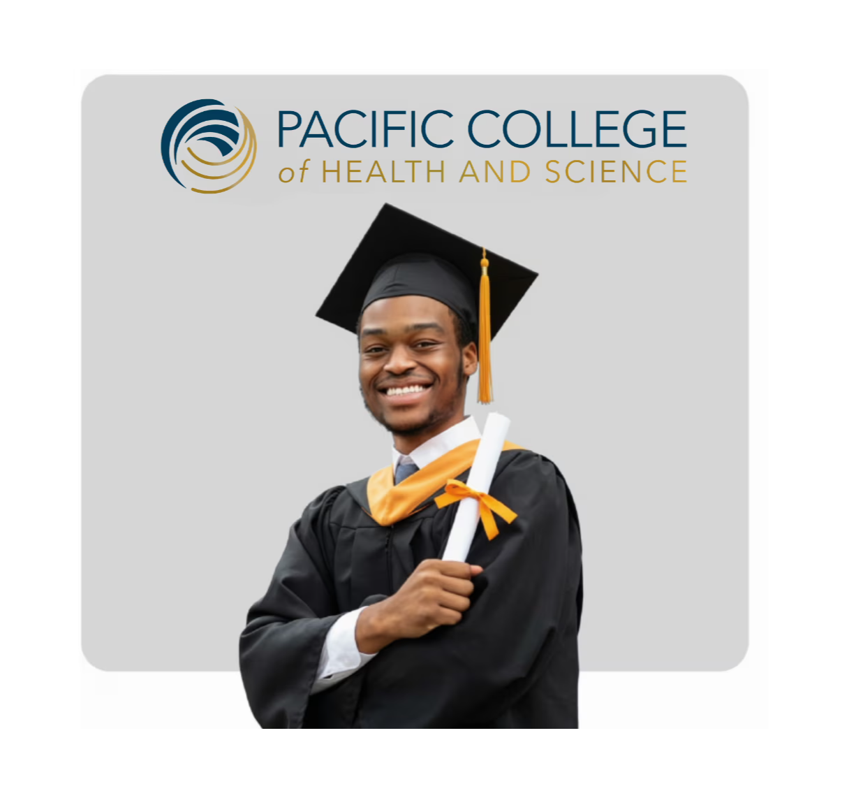 Smiling graduate holding a diploma, wearing a cap and gown.