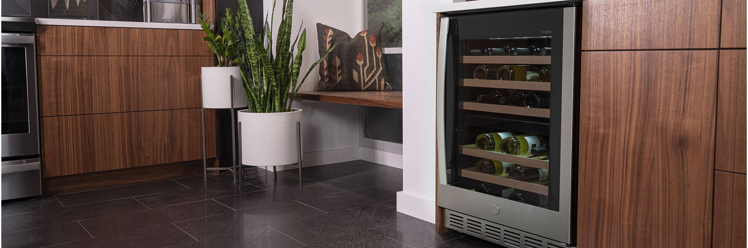 GE Appliances wine and beverage center installed under a  kitchen countertop.