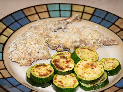 Baked pheasant and zucchini on a plate