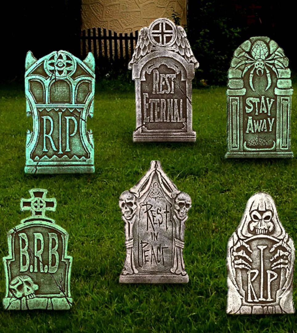 Six tombstones on grass. Shop all tombstone decorations and graveyard props for Halloween.