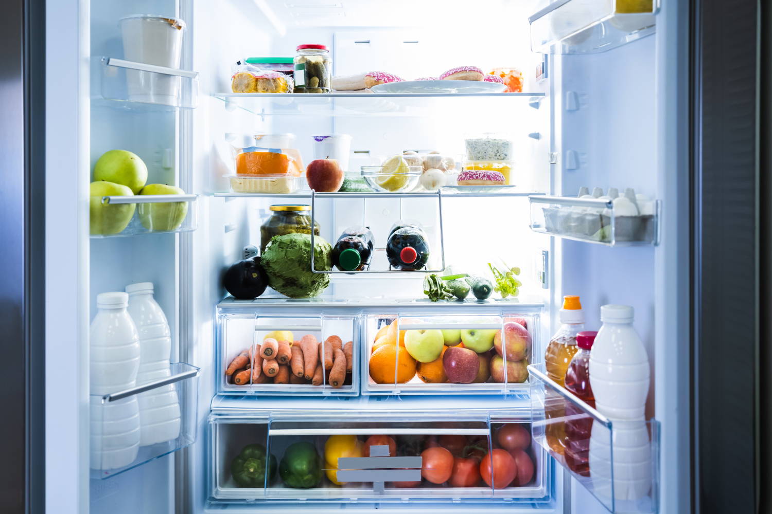 inside a fridge, freah fruit and vegetables and groceries