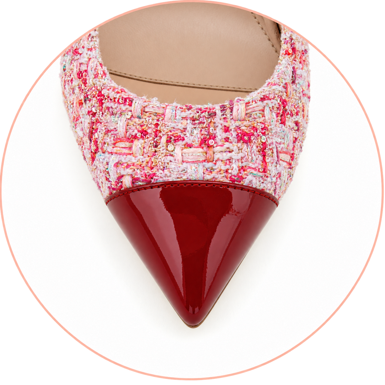 Close-up of a stylish pink and red high-heeled shoe.