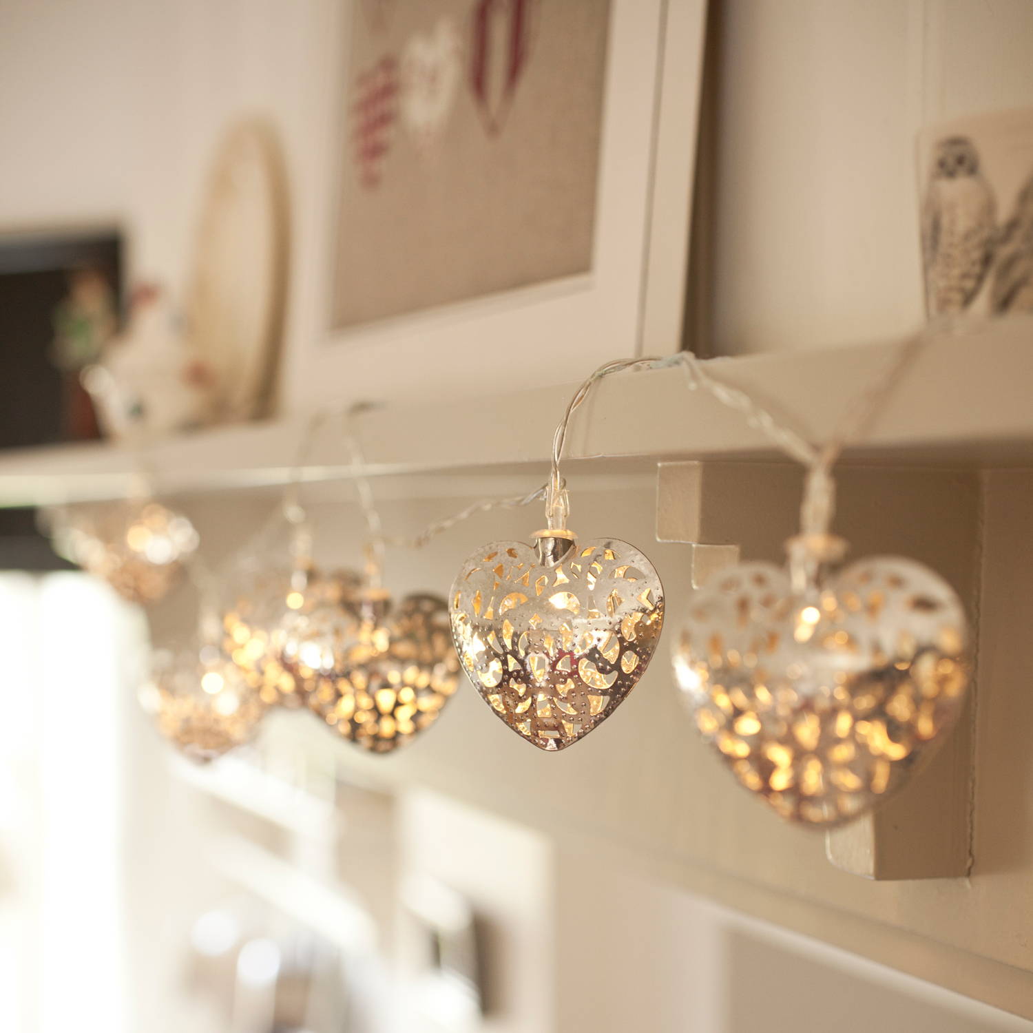 20 led silver filigree heart indoor fairy lights hanging from mantel