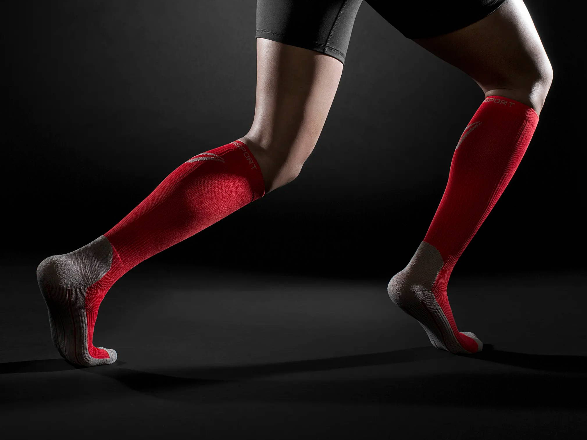 Woman wearing ThearaSport Athletic Compression Socks in Red