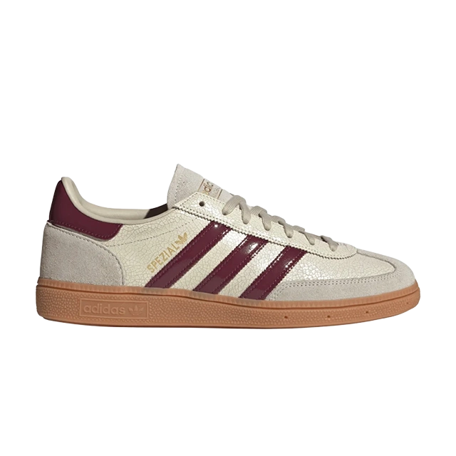 White and maroon athletic shoes with three stripes and gum sole.
