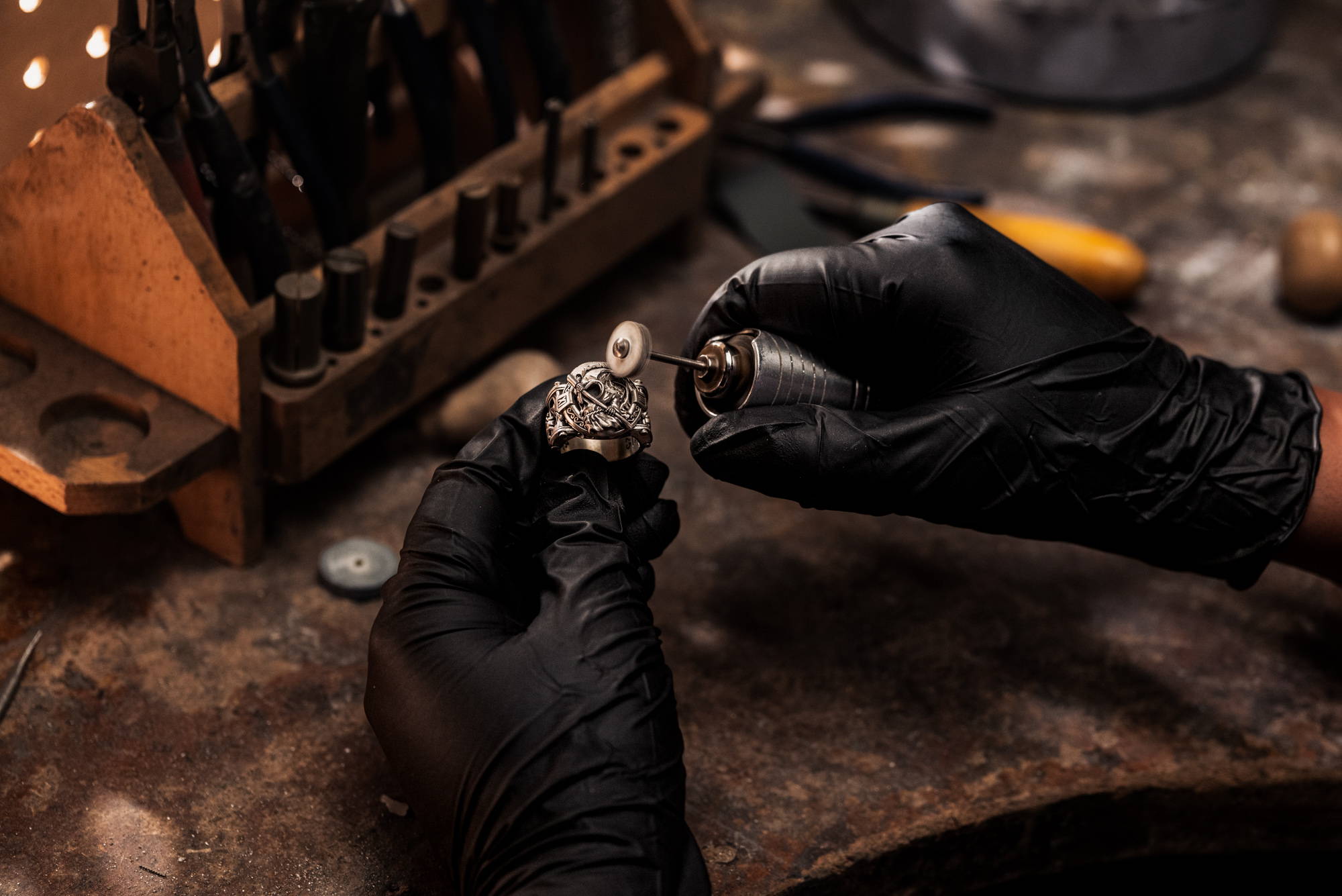 A NightRider Master Jeweler handcrafting a Reckoning Ring