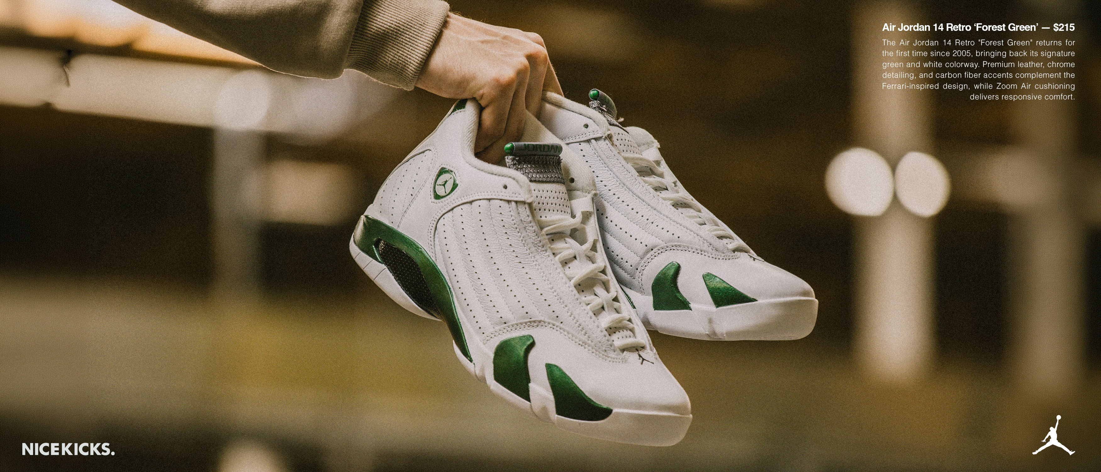A person holding green and white sneakers in a blurred background.
