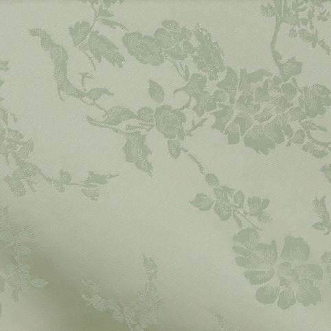 Light green floral pattern on a soft, textured background.