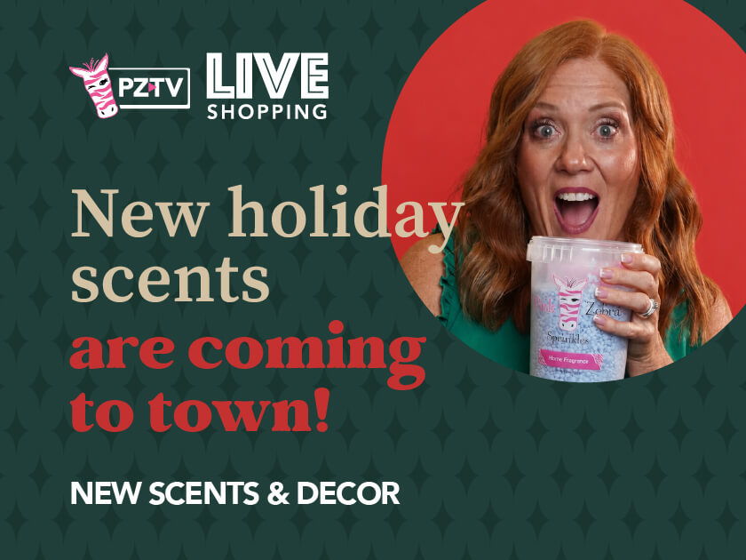 Woman excitedly holding a cup, promoting new holiday scents and decor.