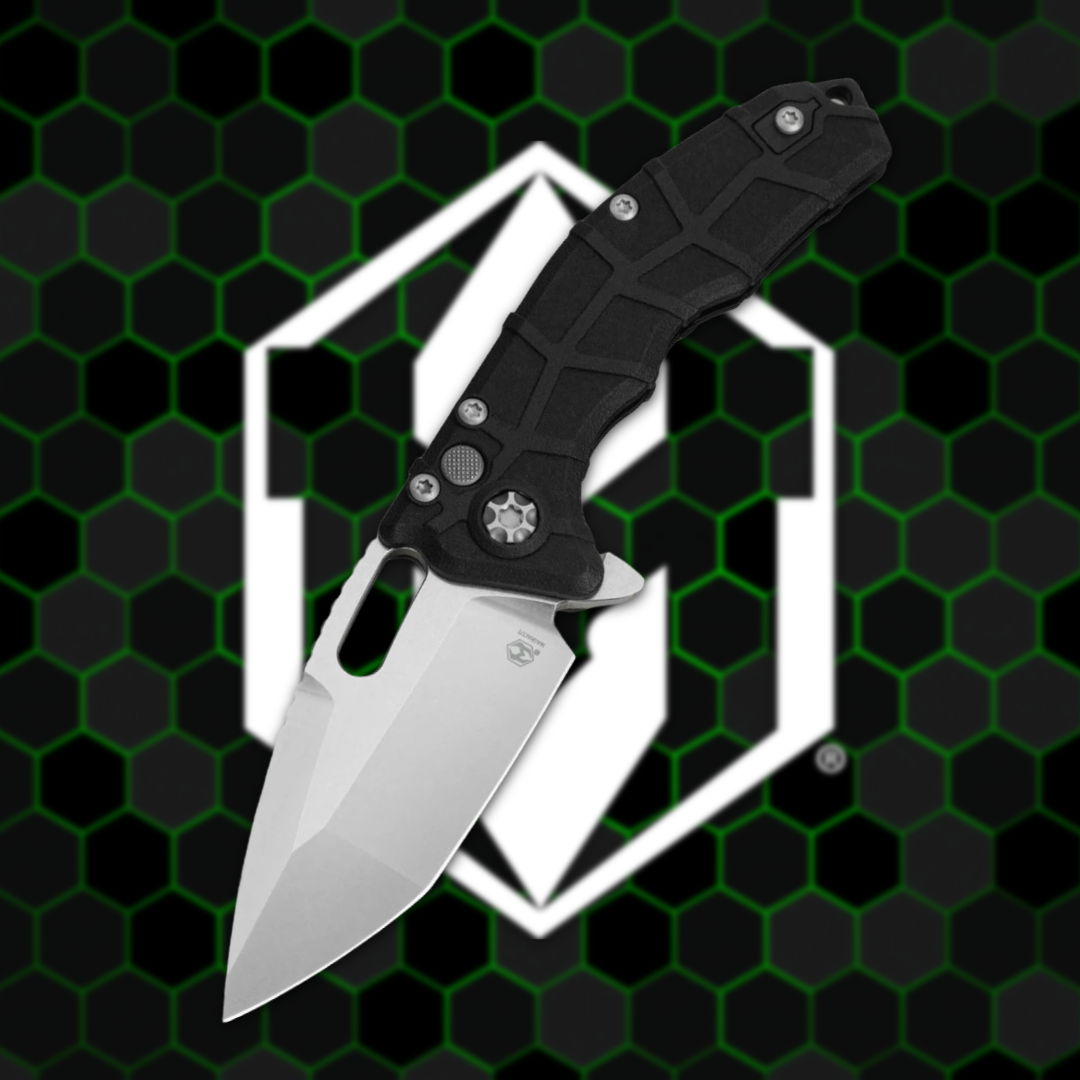 Black folding knife on a hexagonal patterned background.