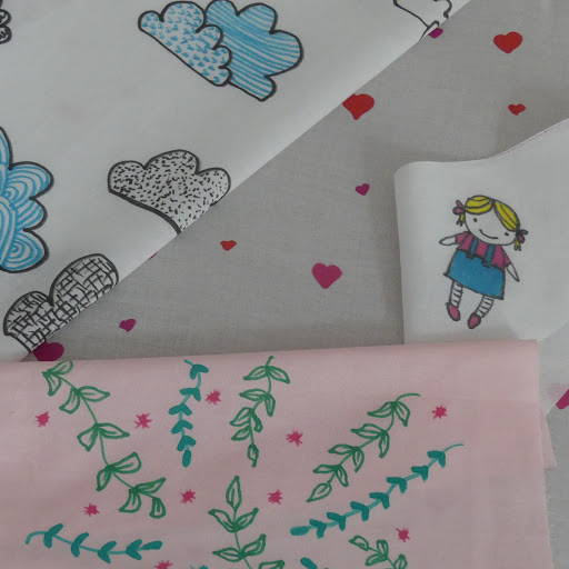 Drawings with markers on white and pink fabric