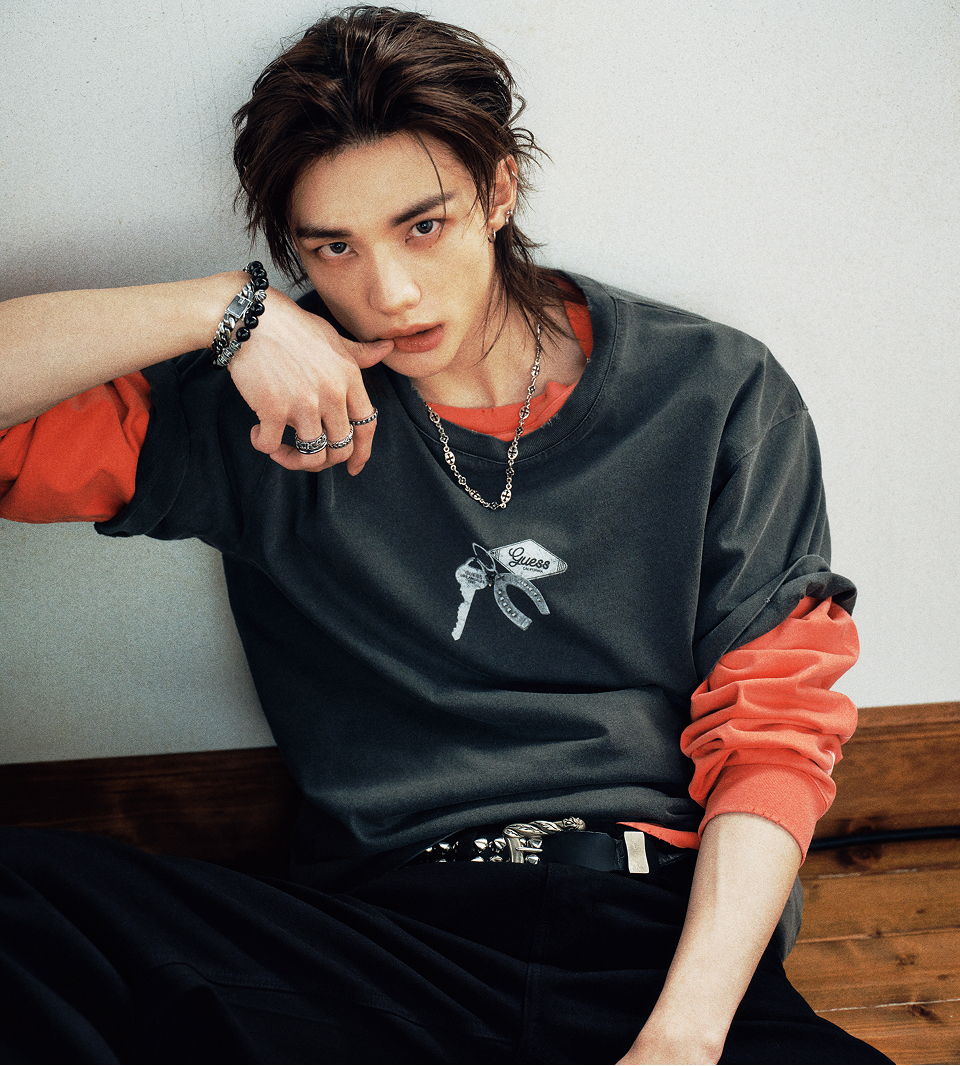 Hyunjin wearing the new Hyunjin x GUESS collaboration