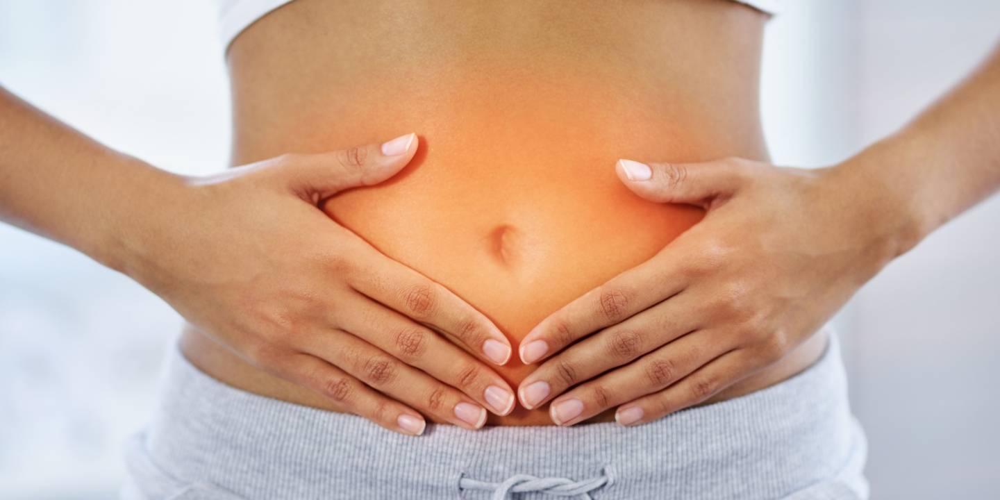 Woman holds belly