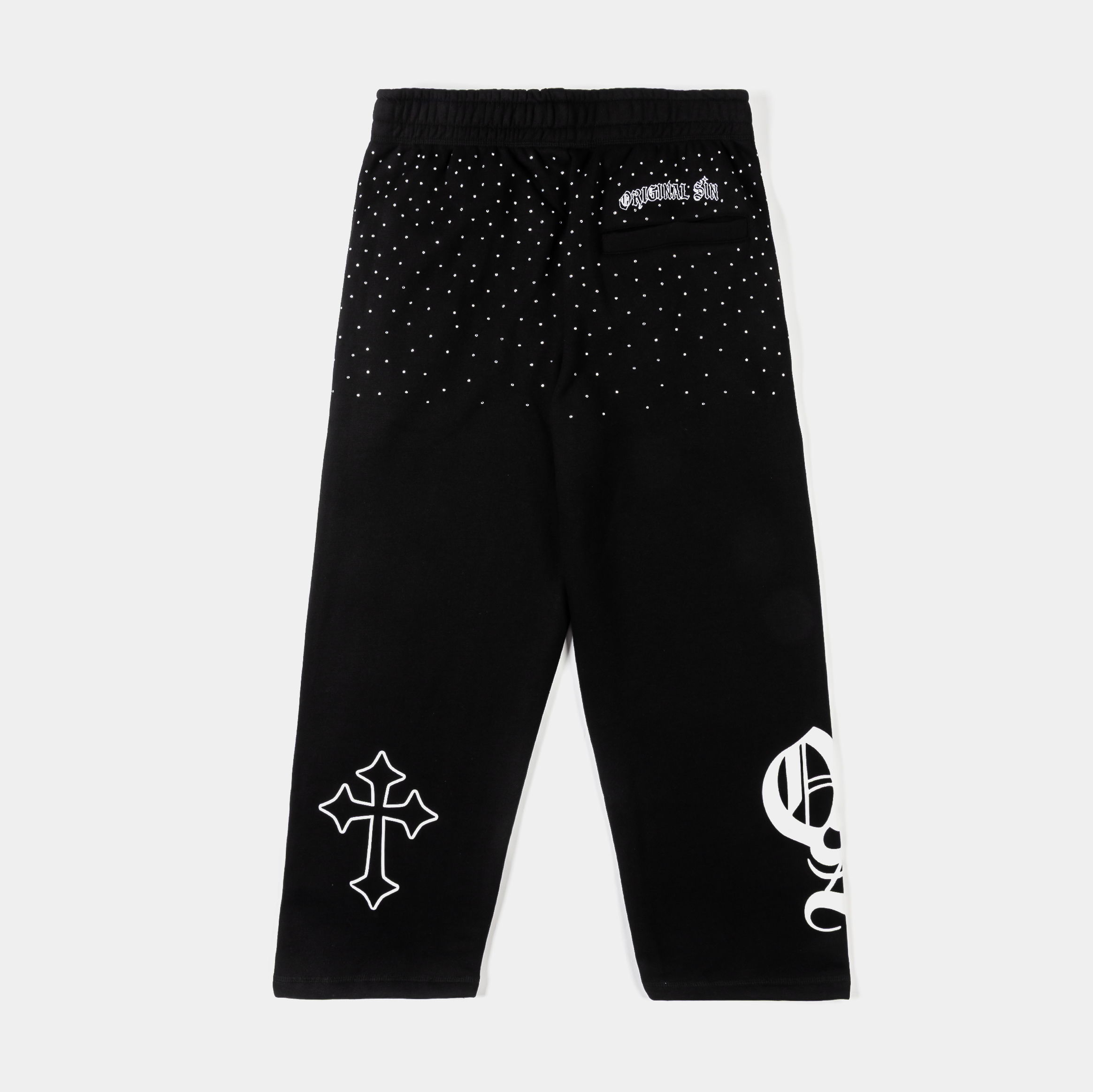 Black pants with various graphic designs and text.
