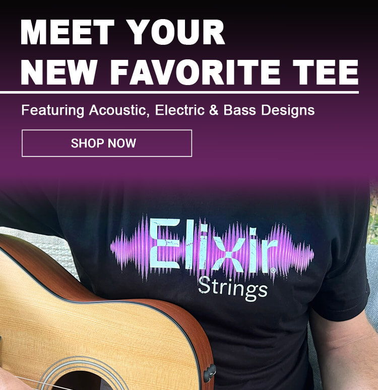 Person holding a guitar wearing a t-shirt with 
